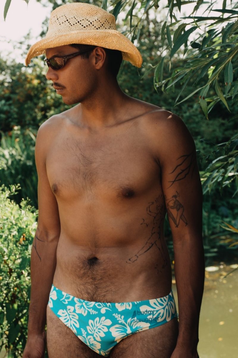 Man in a straw hat by a creek wearing Alt Lei-zy Days smugglers