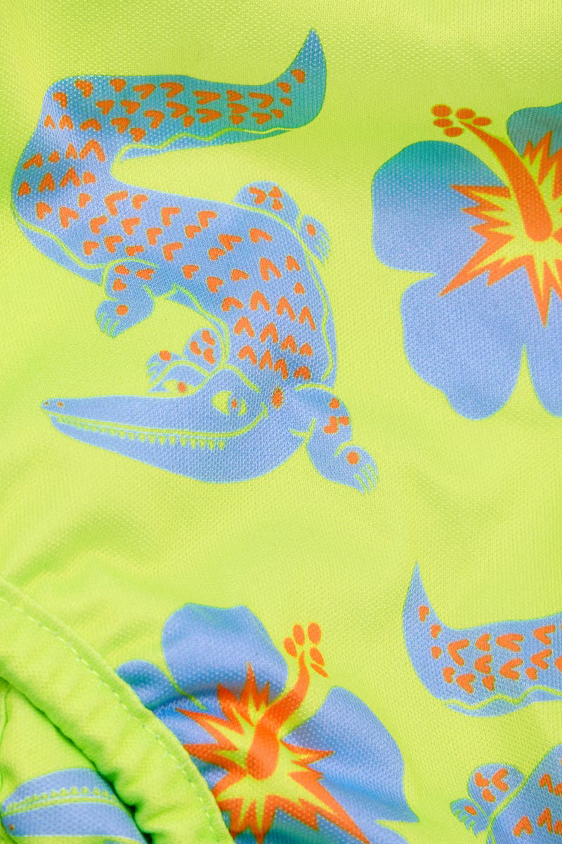 Close up of the crocodile and hibiscus print on the swim nappy