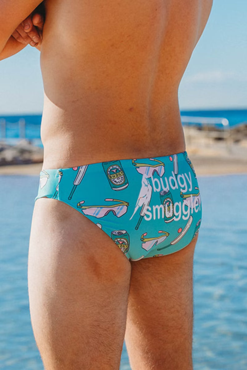 Side view of Peak Performance budgies worn at an ocean pool