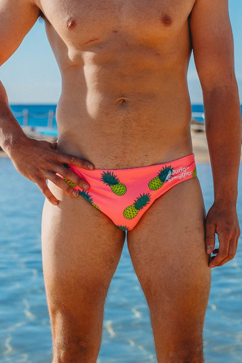 Front view of Pink Fineapples men's swimwear with pineapple print